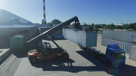 Container Handler Moving Containers in Logistics Center Video stock 56203191