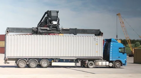 Container Handler unloading a Truck in Port Terminal. No Logos. Video stock 45862989