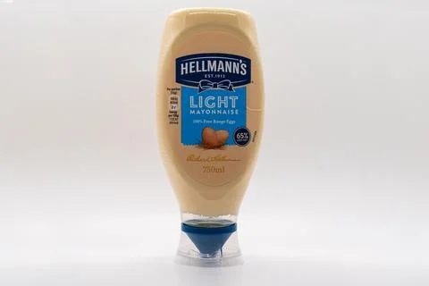 A container of Hellmann's Light Mayonnaise on a white background Stock Photos