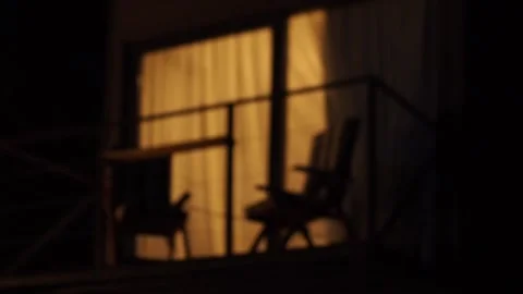 A container house balcony window with outdoor furniture blurred shot Stock Footage 248528669