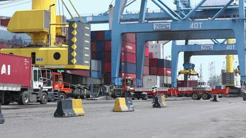 Container loading and unloading at busy port with heavy machinery at work Stock Footage 318201218