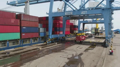 Container loading and unloading process at busy port terminal Stock Footage 318206646