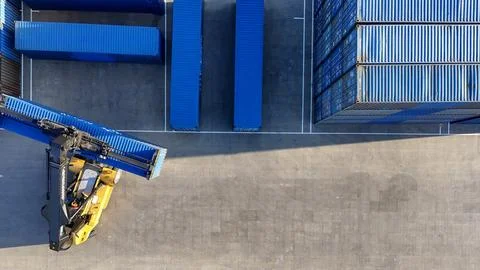 Container loading vehicle. Operation of a telehandler at a logistics center.. Stock Photos