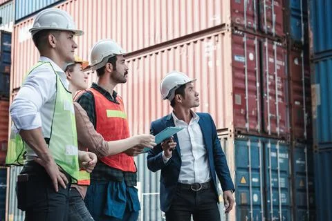 Container Logistics Shipping Storage Management Industry Team, Manager is Bri Stock Photos