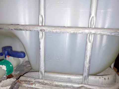 Container for Measuring Cubic Capacity Located in a Storage Area During Day.. Stock Photos