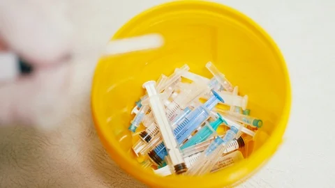 Container with needles from syringes for processing Video stock 100587268