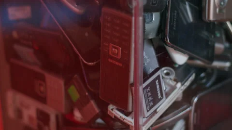 Container with old cellphones 4K. Video stock 221552183