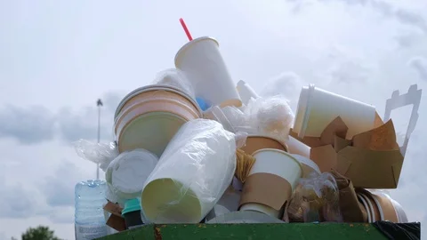 Container with paper and plastic trash. Stockbeeldmateriaal 113413196