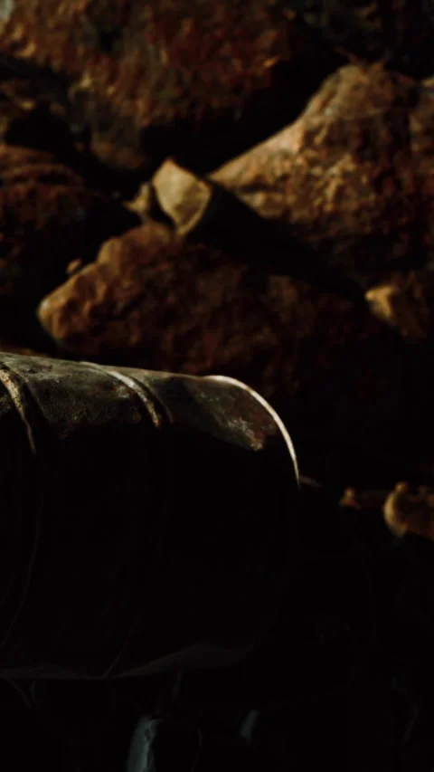 Container placed on rocky surface in a dimly lit area during afternoon Stock Footage 348103717
