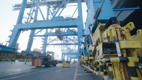 A container is placed on a truck in the harbor 1 Stock Footage 118759820