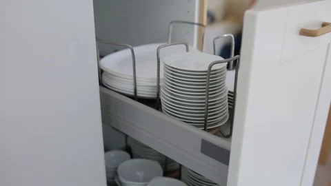 Container of Plates and Bowls in a Kitchen Stock Footage 99962115