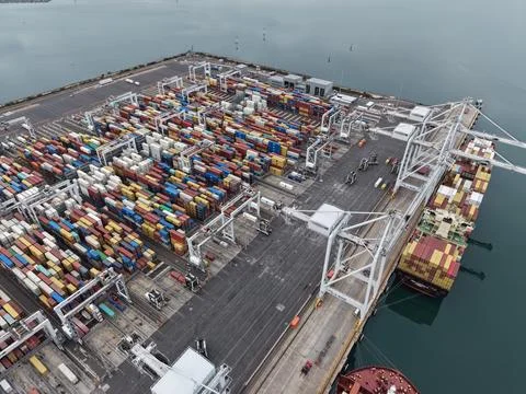 Container port logistics operation with cargo ship Stock Photos