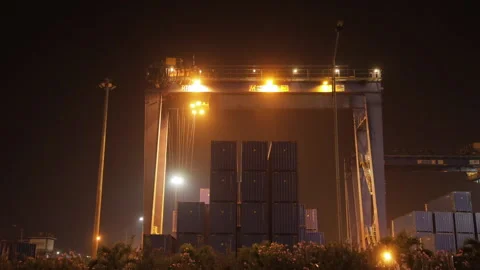 Container Port at Night in Timelapse, Lifting Container at Port Terminal Stock Footage 150842870