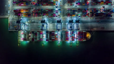 Container port terminal facility in night light import export business finance Stock-Footage 336270168