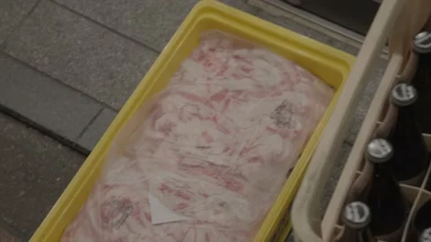 Container of raw meat on store front floor Stock Footage 230113218