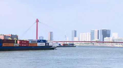 Container river ships cross in front of Willemsbrug- Rotterdam Stock Footage 33520530