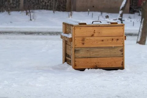 Container with sand and salt for processing snowy sidewalk in winter season. Stock Photos