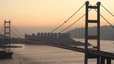 Container Ship Across the Tsing Ma Bridge at Dusk Stock Footage 8510778