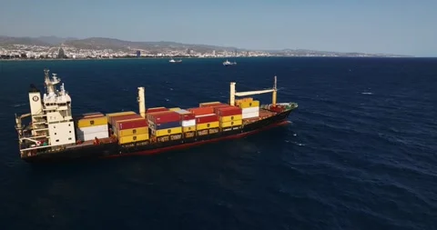 Container ship and cityscape. Limassol, Cyprus - february 28, 2024 Stock Footage 267286190