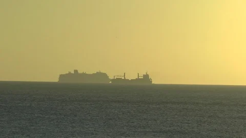 Container ship and Cruise Liner In A Caribbean Sunset Stock Footage 106816738