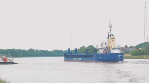Container ship and ferry on Kiel Canal, Germany Stock Footage 100133542