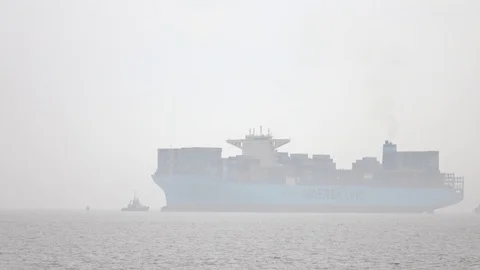 Container ship approaching port on misty morning Stock Footage 91092909
