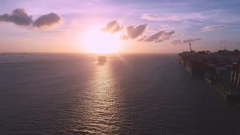 Container ship arrive Shanghai Yangshan container port in sunset.China Stock Footage 94437574