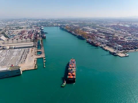 Container Ship Arriving At Busy Deep Sea Commercial Port In Laem Chabang Ch.. Stock Photos