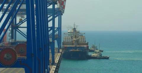 A container ship is being berthed in jetty Fotos Stock