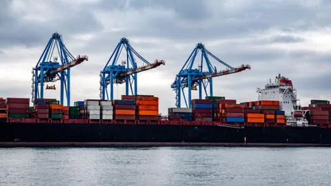 Container ship being loaded at the Port of Genoa, Italy Stock Photos