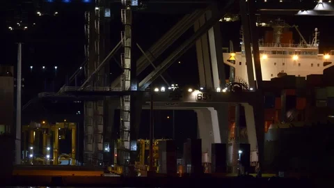 Container ship being loaded at Ports of Auckland's container terminal at night Stock Footage 89411581