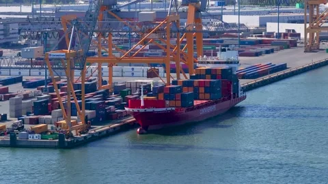 Container ship being loaded in Vuosaari port on a summer day, Helsinki, Finland Stock Footage 242077680