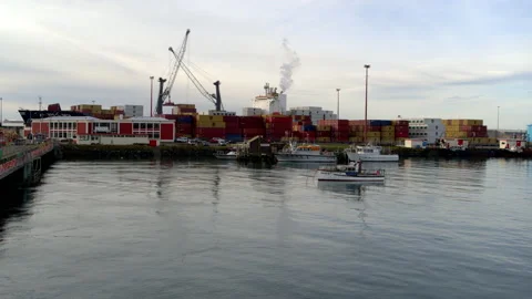Container ship being unloaded at South Port low level aerial Stock Footage 155369925