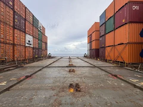 Container Ship Cargo Deck Between Stacked Shipping Containers Stock Photos