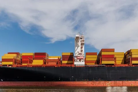 Container ship carrying container box in import export with quay crane, Global Stock Photos