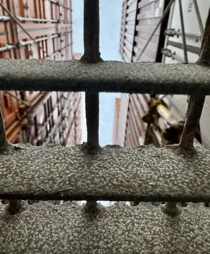 Container Ship Catwalk View Through Safety Grating Between Stacked Containers Stock Photos