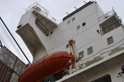 Container ship close - up. Part of large merchant ship Stock Photos