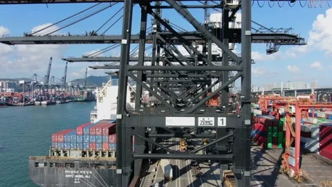 Container Ship docked at port during loading and unloading operation. Stock Footage 154292379