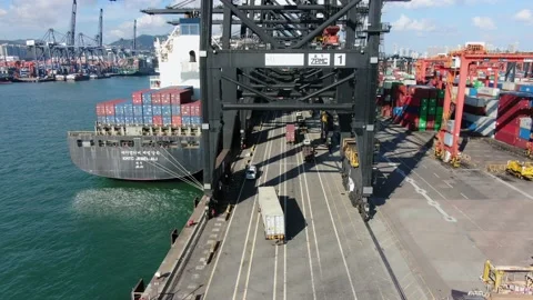 Container Ship docked at port during loading and unloading operation. Stock Footage 154292518