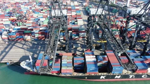 Container Ship docked at port during loading and unloading operation. Stock Footage 154293174