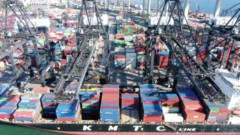 Container Ship docked at port during loading and unloading operation. Stock Footage 154293306