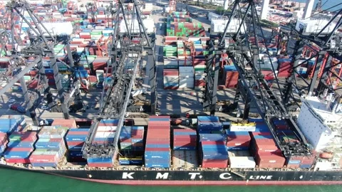 Container Ship docked at port during loading and unloading operation. Stock Footage 154293359