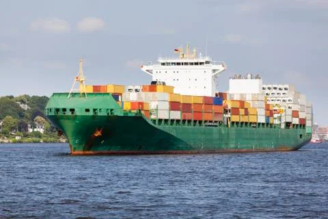 Container ship on the elbe river in hamburg harbor, germany Stock Photos