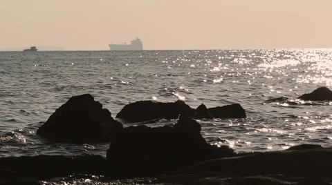 Container ship entering Dardalnelles strait  with fishing boat in front plane Stock Footage 46441943