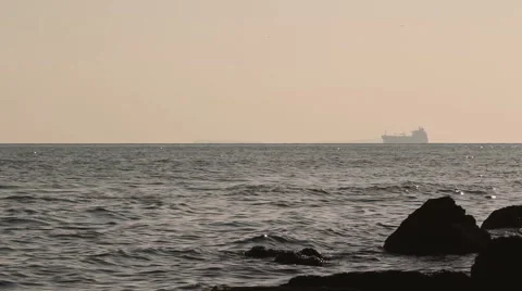 Container ship entering Dardalnelles strait  in Turkey at sunset Stock Footage 46443228