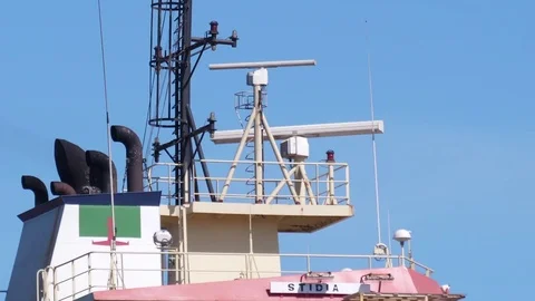 Container ship entering harbor Stock Footage