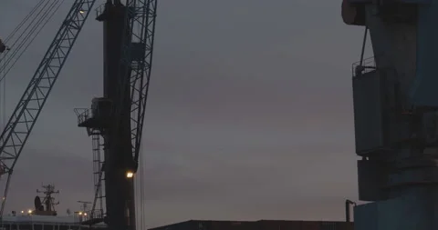 Container Ship at Hamburg Harbour offloading with a crane Stock Footage 134489587