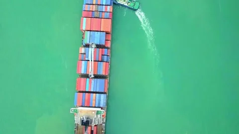 Container ship import export business logistic in sea with tugboat Shipping to Stock Footage 336446553