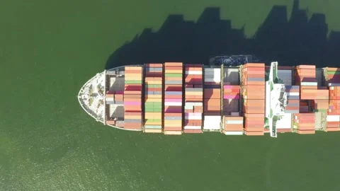 Container ship import export business logistic in sea with tugboat Shipping to Stock Footage 336446597