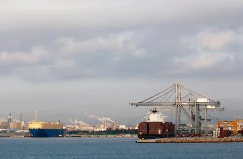 Container ship with industrial background Stock Photos